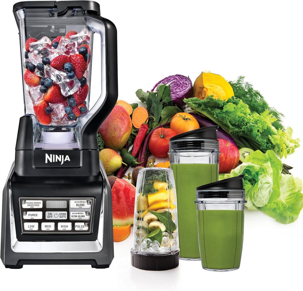 Ninja BL642 Auto-iQ blender system surrounded by fresh fruits and vegetables
