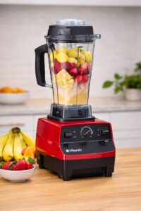 Vitamix 5200 blender making a strawberry smoothie on a modern kitchen counter