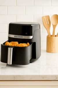Black+Decker Purifry Air Fryer with fried chicken on kitchen countertop