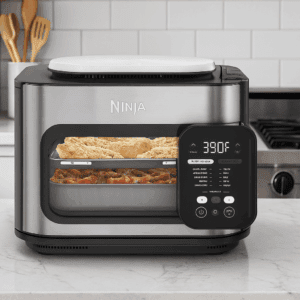 Ninja Combi Cooker on modern kitchen countertop with food inside