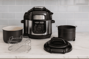 Ninja FD401 Foodi 12-in-1 Deluxe XL 8-quart Pressure Cooker & Air Fryer with accessories on a modern kitchen countertop