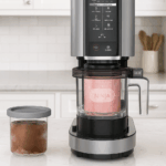 Ninja NC301 CREAMi ice cream maker on modern kitchen counter with frozen desserts