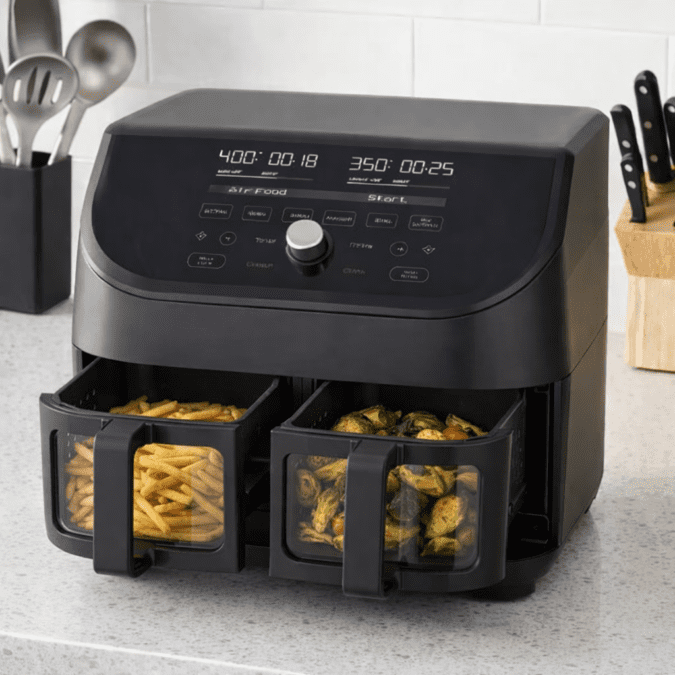 Instant Pot Vortex Plus XL 8QT ClearCook air fryer with dual baskets open showing fries and roasted vegetables through viewing windows