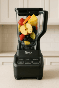 Ninja BL610 Professional Blender on light kitchen countertop with fruit-filled container