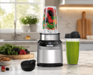 Ninja BN401 Nutri Pro personal blender on a modern marble kitchen countertop with smoothie cup and fresh berries