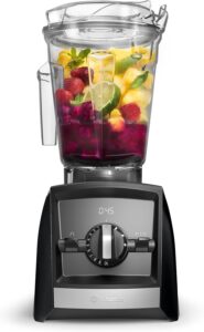 Vitamix A2500 blender filled with pineapple berries and fresh ingredients ready for blending