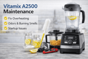 Vitamix A2500 blender with container removed and cleaning supplies displayed for maintenance, overheating prevention, and odor removal