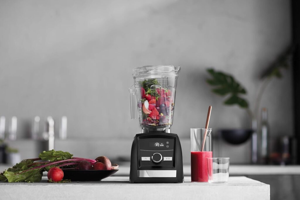 Vitamix A3300 with 64 oz container filled with fruits for smoothies.