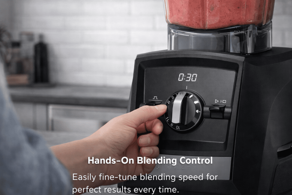 Hand adjusting Vitamix A2500 speed dial during blending