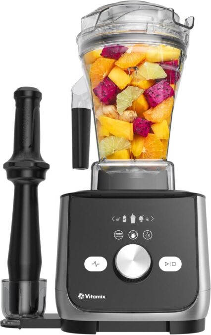 Vitamix Ascent X5 blender in brushed stainless finish blending a smoothie on a kitchen counter