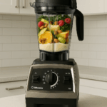 Vitamix Propel 750 blender on white kitchen countertop with fruits and greens